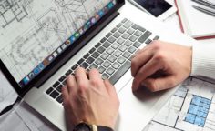 Man doing in-house area calculations on a laptop