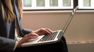 Woman typing on laptop