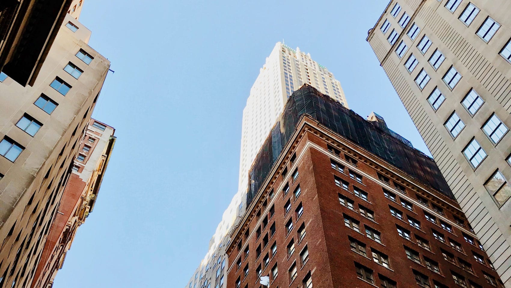 Looking up at skyscrapers