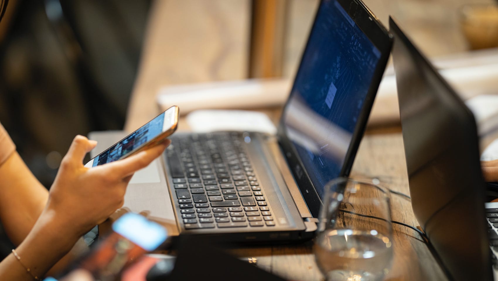 Person using computer and phone